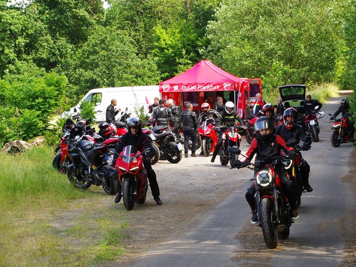 Ducati riders setting off on a community tour
